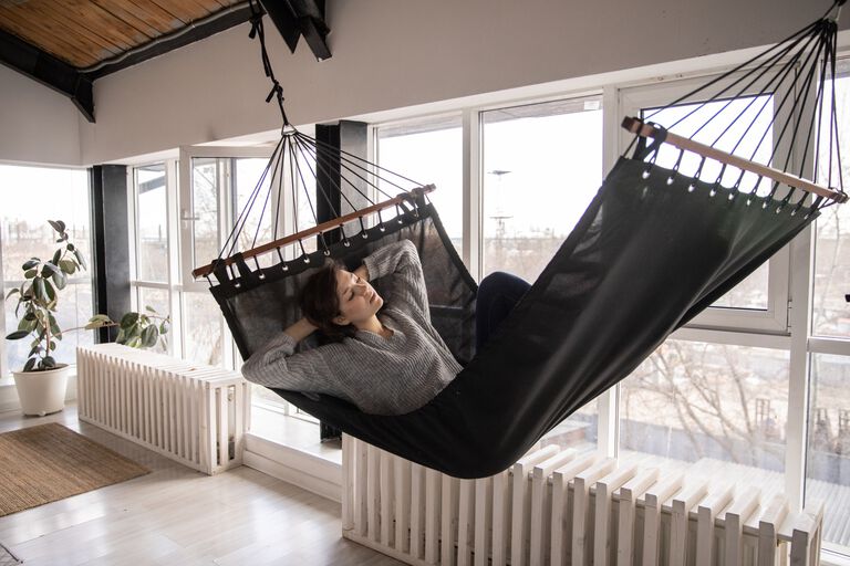woman reclining on a hammock